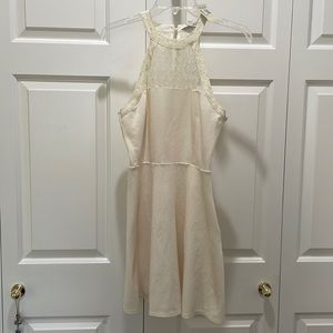 White halterneck A-line dress with lace panel detailing